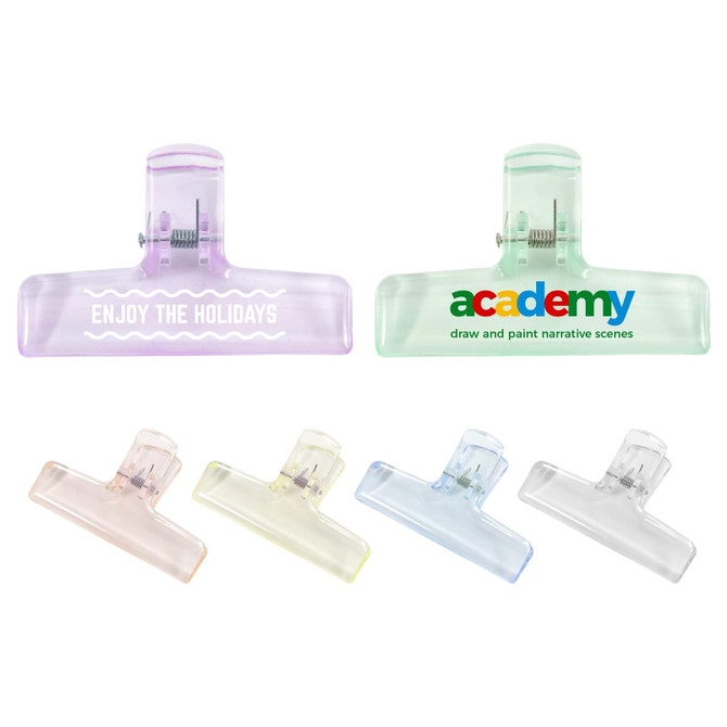 A set of translucent plastic clips in purple, green, yellow, and clear, featuring various logos and designs.