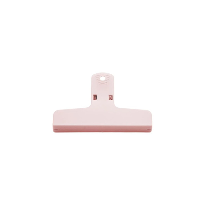 A pink plastic clip with a hanging hole. The design is simple and functional, suitable for various uses.