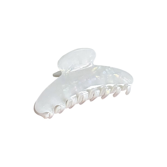 An acetate hair clip in a pearlescent white colour, featuring a curved design with multiple grip teeth.