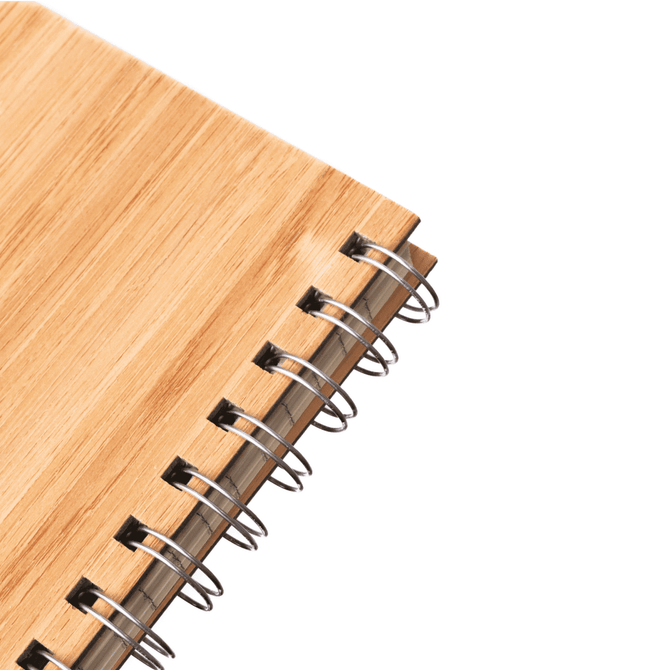A bamboo notebook featuring a natural wood finish and spiral binding. It has a simple, eco-friendly design.
