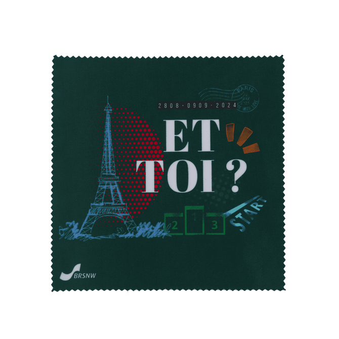 A small green microfibre cleaning cloth featuring the Eiffel Tower and colourful designs, with a logo in the corner.