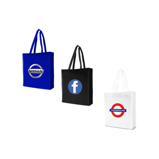 Three tote bags in blue, black, and white featuring logos, each with two handles.