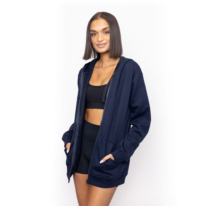 A navy blue full-zip hoodie with a relaxed fit, featuring a hood and front pockets, displayed by a model.