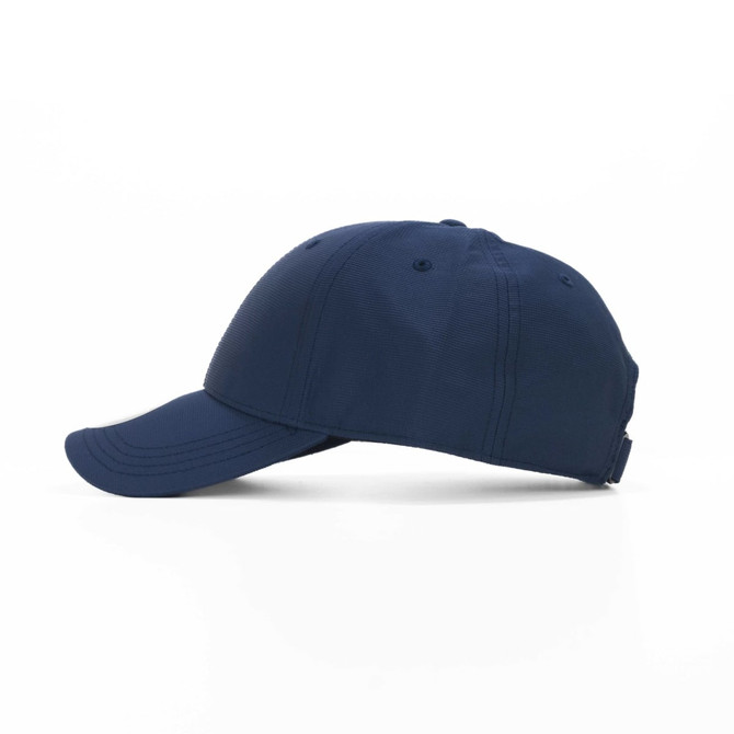 A navy blue cap with a curved brim and a textured finish, featuring a logo on the side.