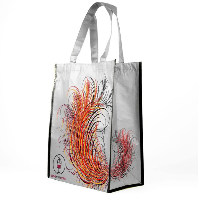 A tote bag featuring a vibrant design with swirling patterns in red, orange, and black, complemented by a logo.