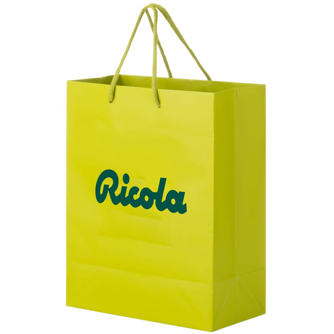 A vibrant green laminated paper bag with two handles and a logo printed on it.