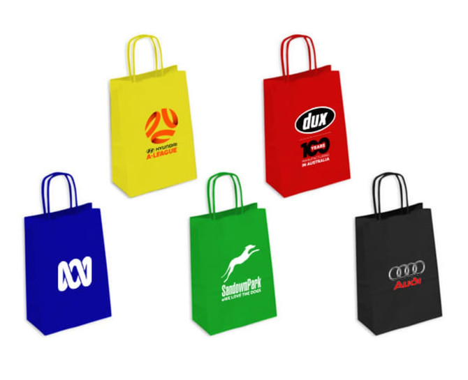 A collection of small coloured kraft paper bags in red, yellow, blue, green, and black, featuring various logos.