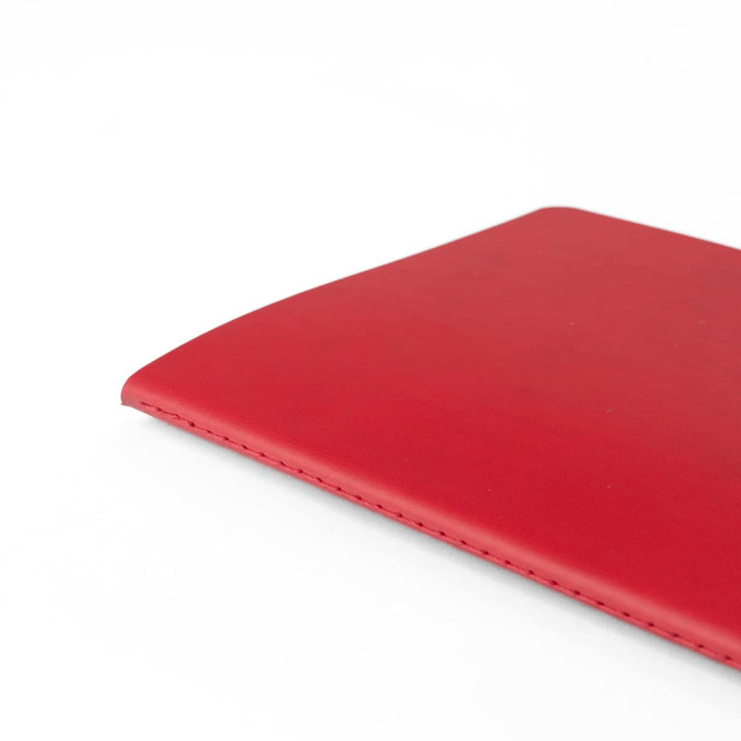 A5 thin notebook with a smooth red PU cover, featuring clean stitching along the edges and a subtle logo.