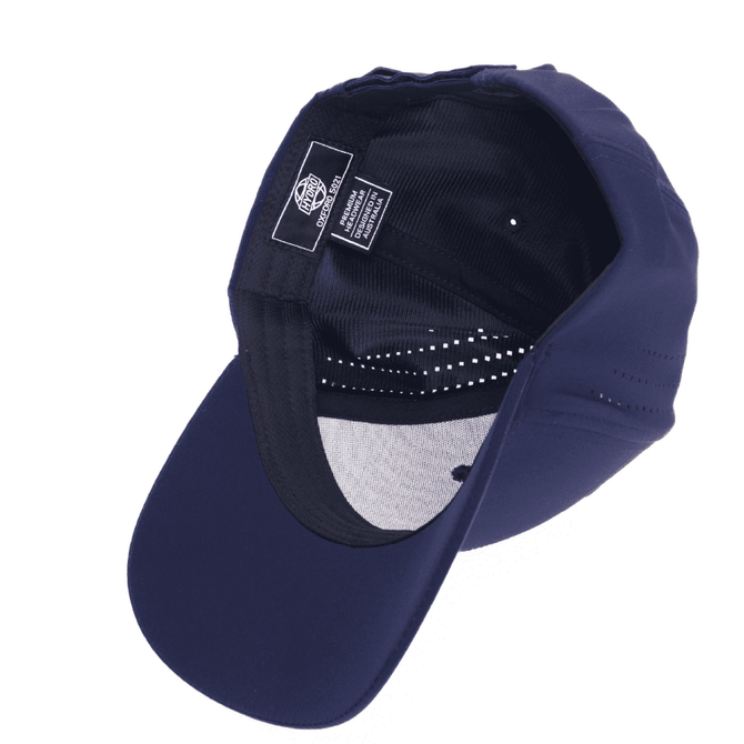 A navy cap with a curved brim, featuring an inner lining and a branding label inside.