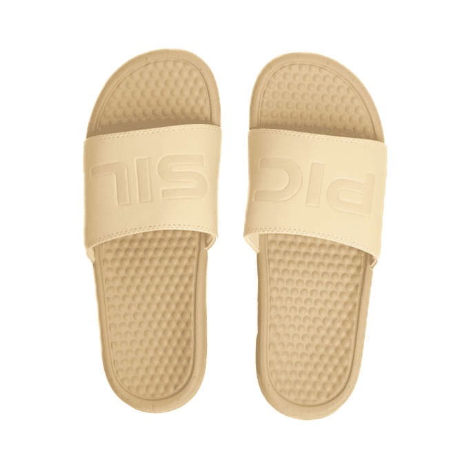 A pair of beige PU debossed slide sandals with a pebble-styled sole and a strap featuring a logo.