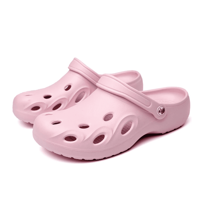 Pink clog slides with ventilation holes and a strap, featuring a logo on the side.