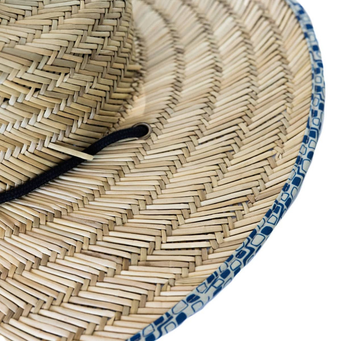 A straw hat with a wide brim, featuring natural straw colours and a blue patterned edge, along with a black strap.