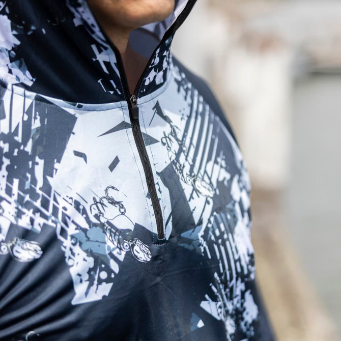 A men's polyester sublimated 1/4 zip fishing hoodie in dark blue with a graphic design and a logo.