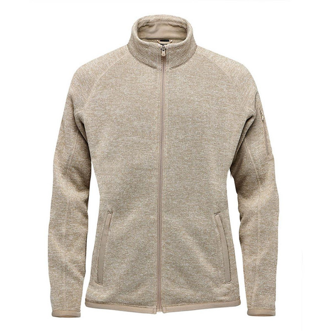A women's polar fleece jacket in beige with a full zip and stand collar, featuring side pockets and a logo.