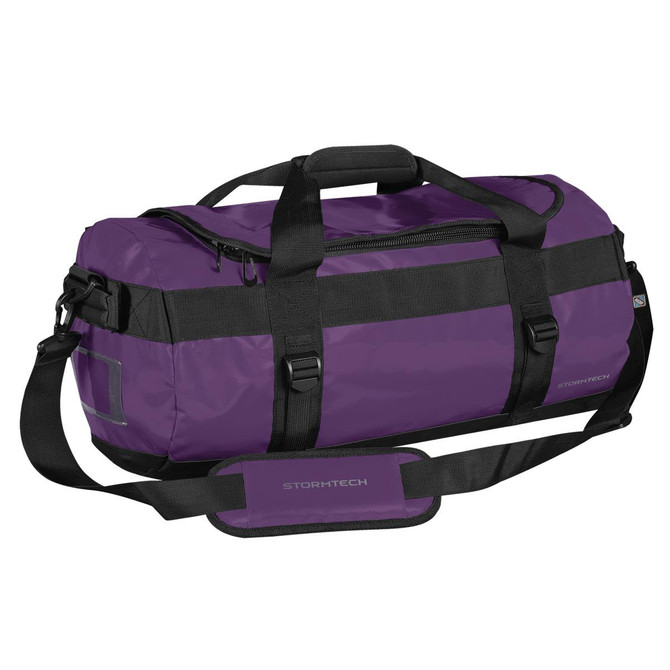 A small duffle bag in purple with black straps, featuring a handle, adjustable shoulder strap, and a logo.