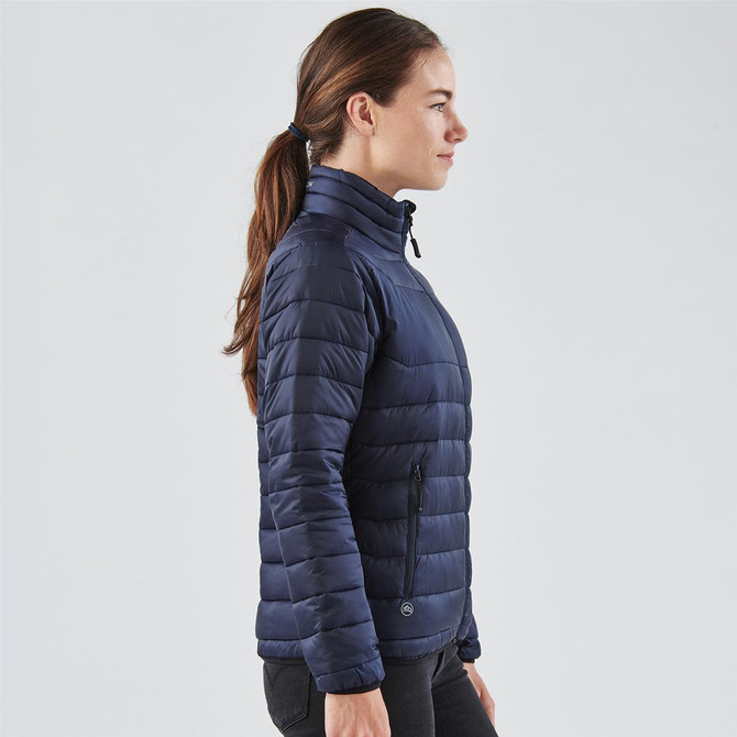 A navy women's Altitude jacket, featuring a zip closure and side pockets, displayed on a model.