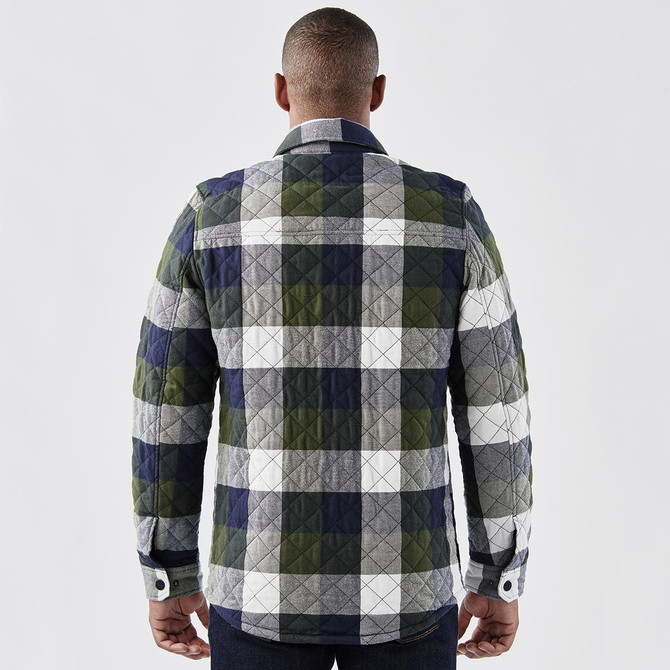 A men's shacket featuring a quilted, multicoloured plaid pattern in navy, green, grey, and white, with a branded logo.