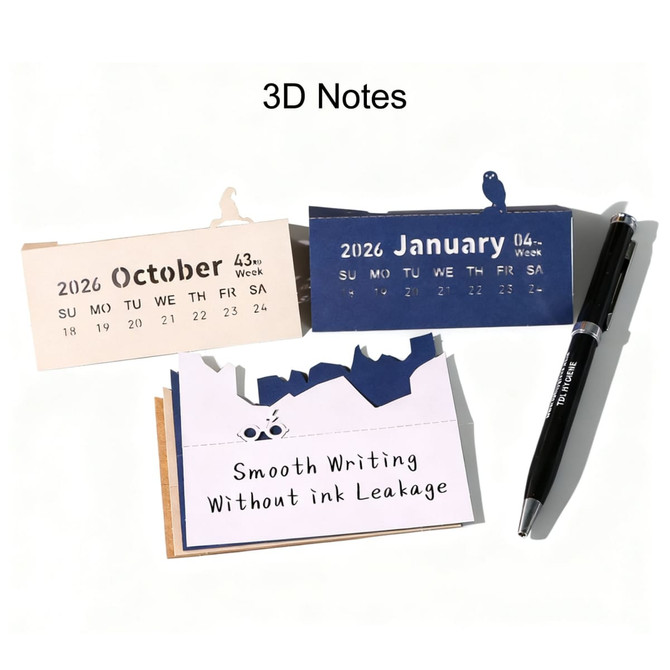 Three 3D paper carving notepads in beige and navy blue, alongside a black pen, each displaying a calendar format.