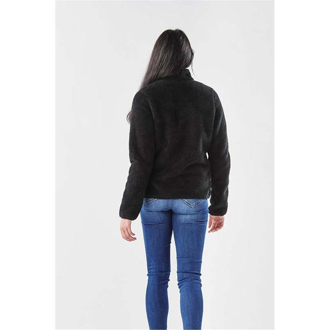 A black women's Bergen Sherpa fleece jacket displayed from the back, worn with blue jeans. The jacket has a branded logo.