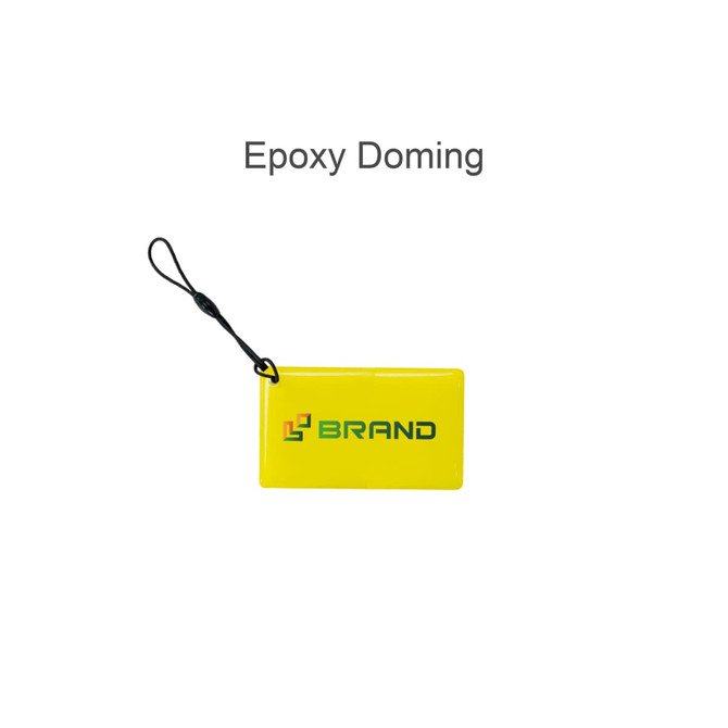 A yellow NFC epoxy square tag featuring a logo and a lanyard attachment.