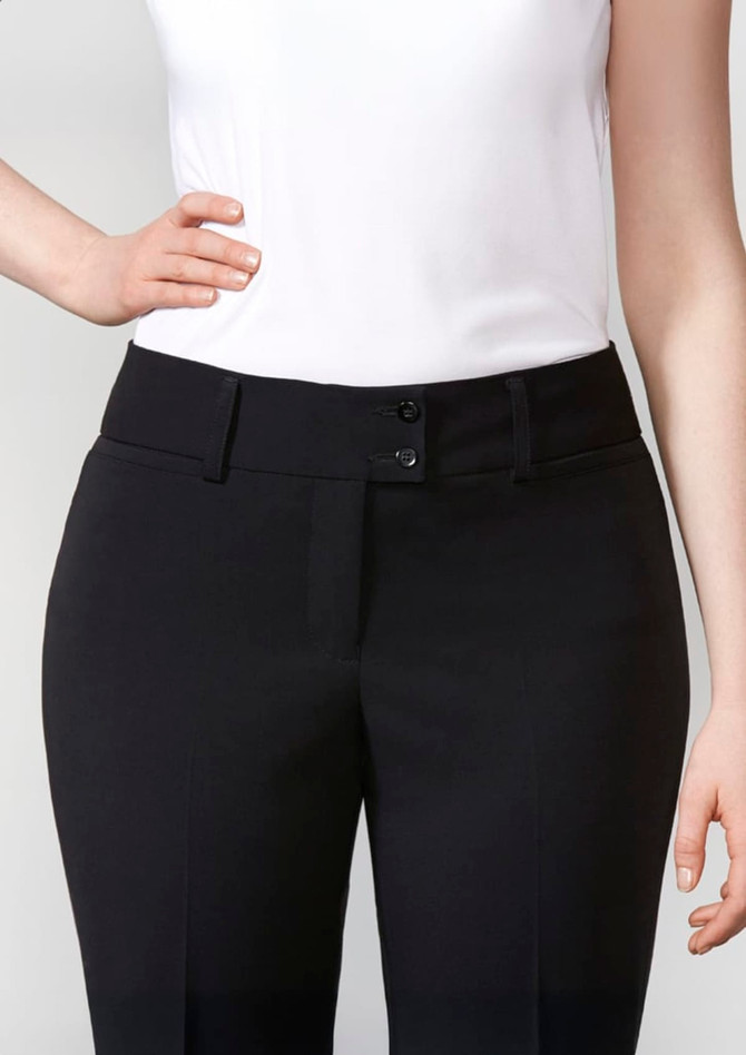 A pair of black women's slacks with a fitted waist and button fastening, worn with a white top.