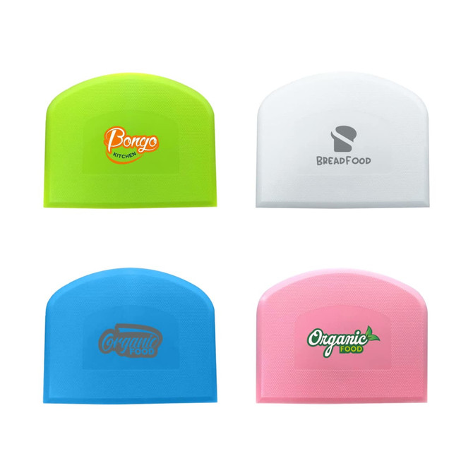 A set of four plastic flexible bowl scrapers in green, white, blue, and pink, each featuring a logo or branding.