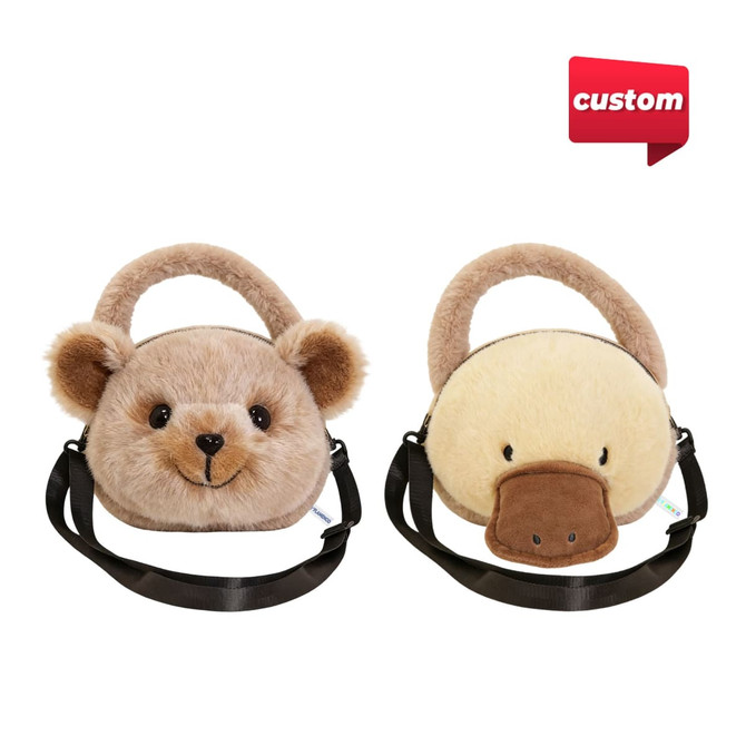 A plush handbag featuring a bear design on one side and a duck design on the other, with a black adjustable strap.