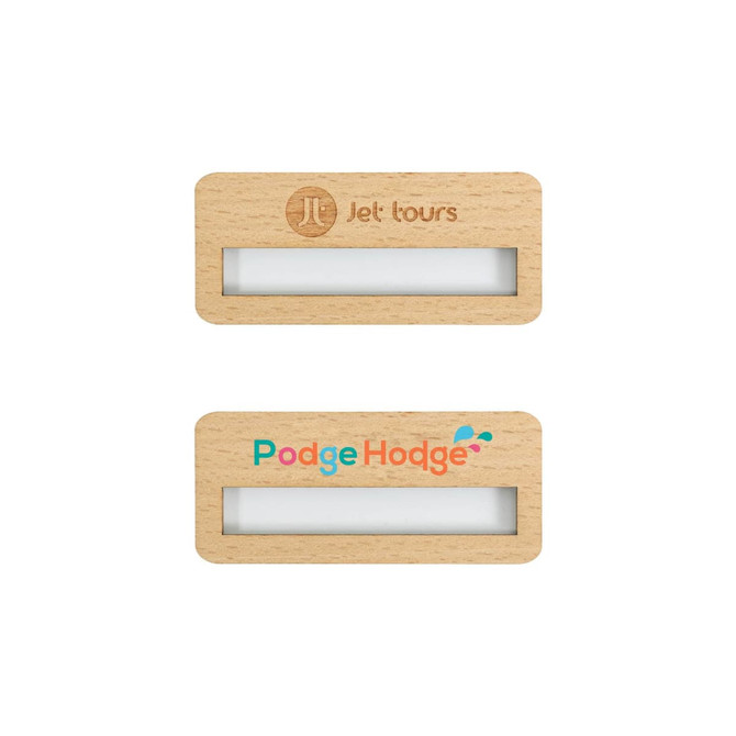 A reusable wooden name badge in light wood with a clear window for name display and a logo at the top.