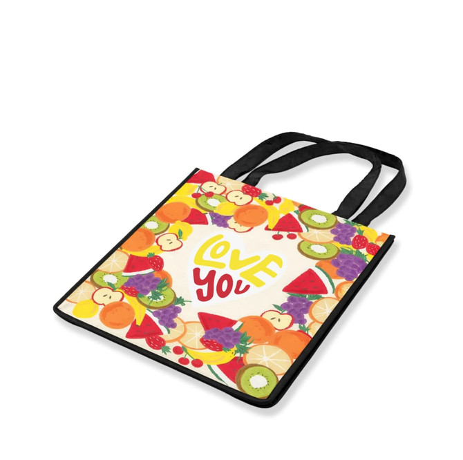 A cotton tote bag featuring a vibrant fruit design with a black handle. It has a colourful background and the phrase "Love You."