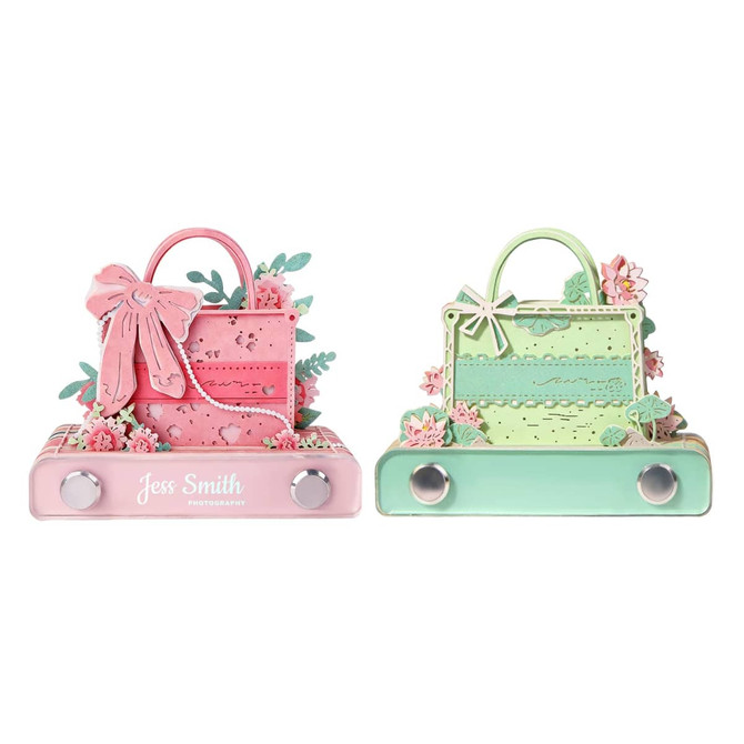 A 3D paper art handbag notepad featuring pink and green designs with floral embellishments and a logo.
