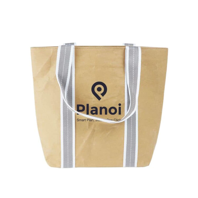A small washable kraft paper bag in brown with grey cotton handles and a logo printed on the front.