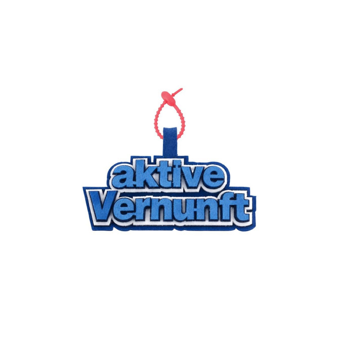 A custom felt logo hanging tag in blue with a red attachment. The tag features layered text elements.