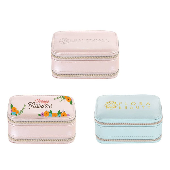 A set of three PU leather jewellery cases in pastel pink and blue, featuring floral designs and zip closures.