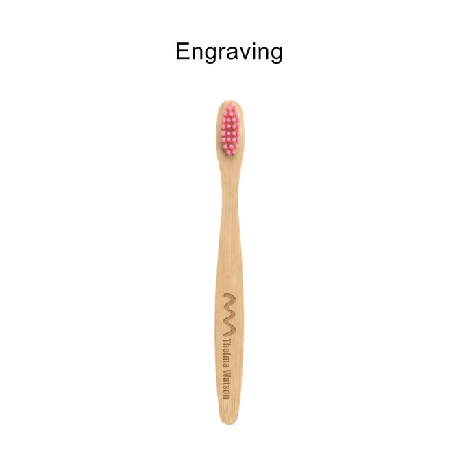 A small bamboo toothbrush with a pink bristle head and a wooden handle featuring a logo engraving.