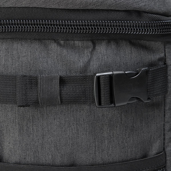 A dark grey backpack cooler featuring a zipper closure and buckle strap for secure fastening.