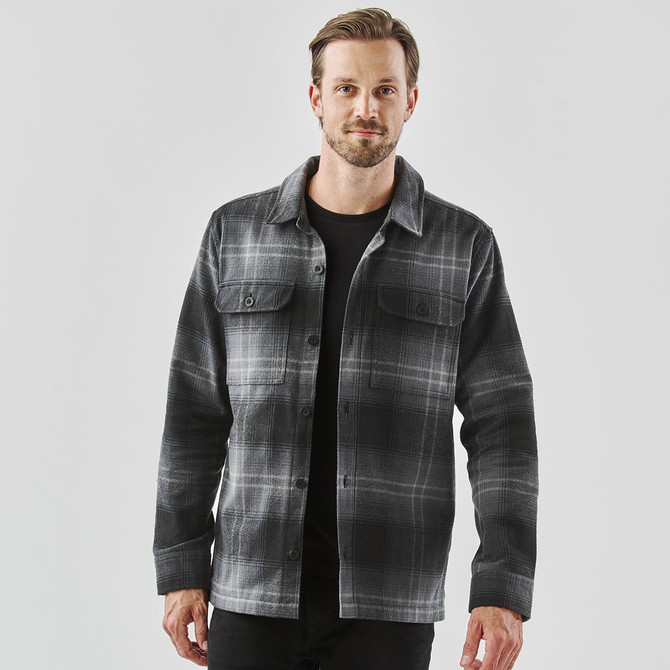 A men's shacket in black and grey plaid, featuring two front pockets and a collar.