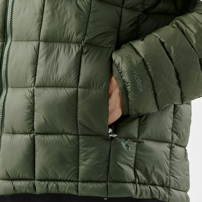 A puffer jacket in a dark green colour featuring a zip closure and a side pocket with a branded logo.