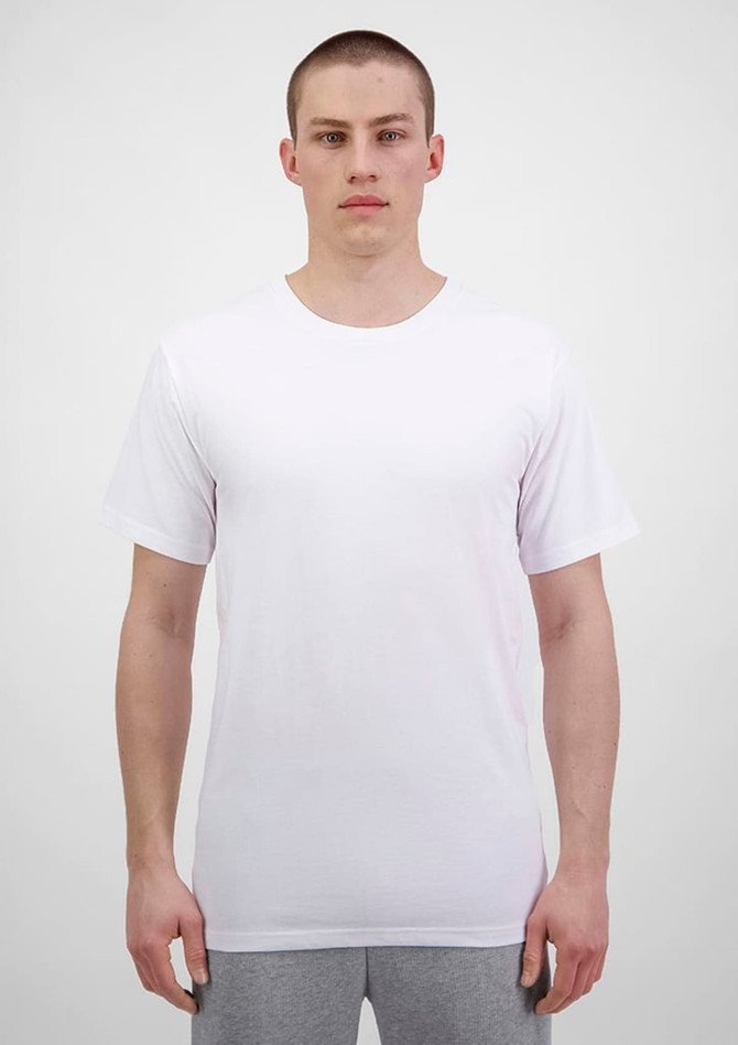 A plain white short sleeve tee displayed on a model, featuring a simple design and a casual fit.
