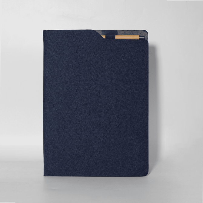 A navy blue A4 notebook with a textured cover, featuring a pocket for documents and a branding logo.