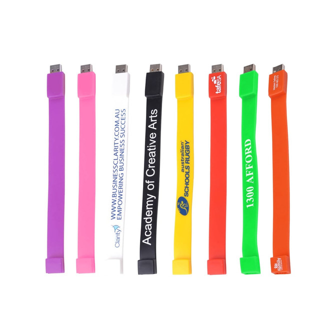 A variety of rectangular silicone wristband flash drives in colours including pink, white, yellow, green, orange, and purple, each with logos.