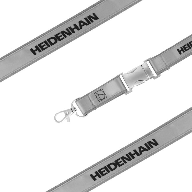 A silver poly satin lanyard featuring a clip and branding, designed for durability and style.