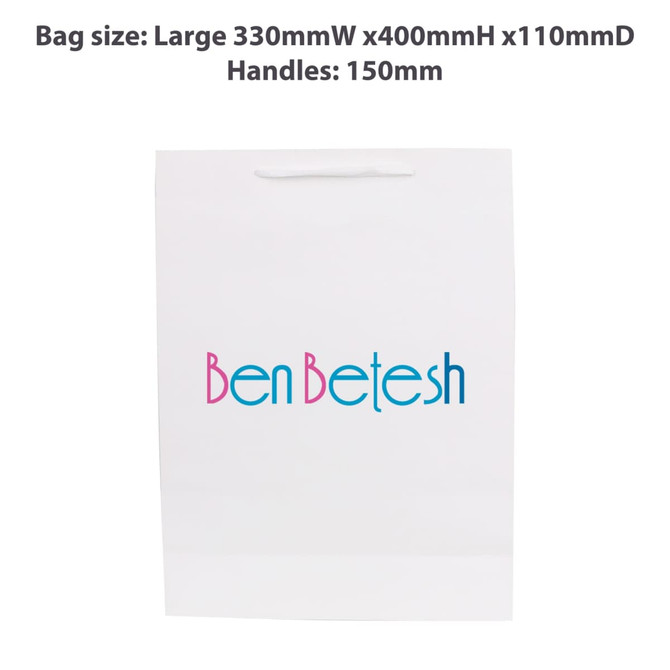 A large white paper bag with a fabric flat handle and a colourful logo printed on the front.
