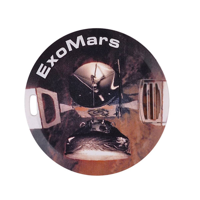 A round flash drive featuring a design related to ExoMars, predominantly in shades of black and metallic grey.