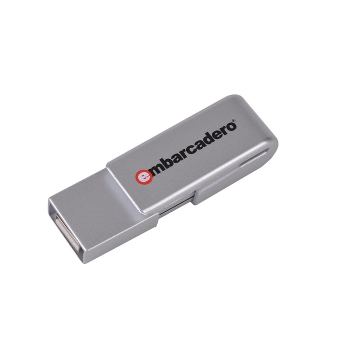 A silver flash drive with a logo, featuring a compact design suitable for technology use.