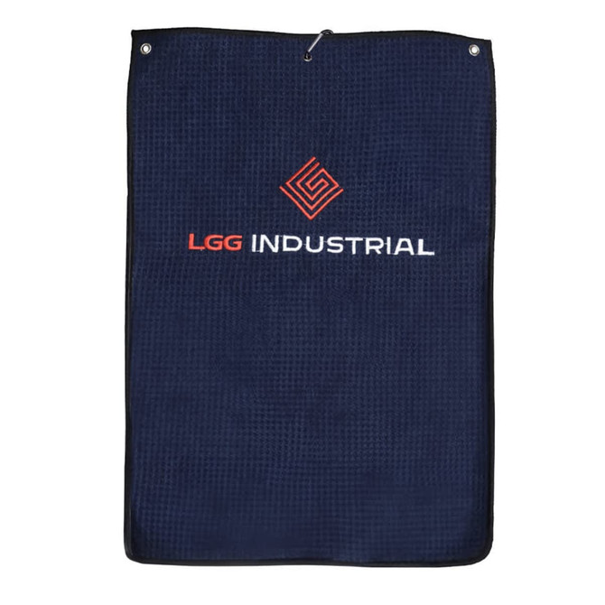 A navy golf towel featuring a textured fabric and a logo. It has a hanging loop for convenience.