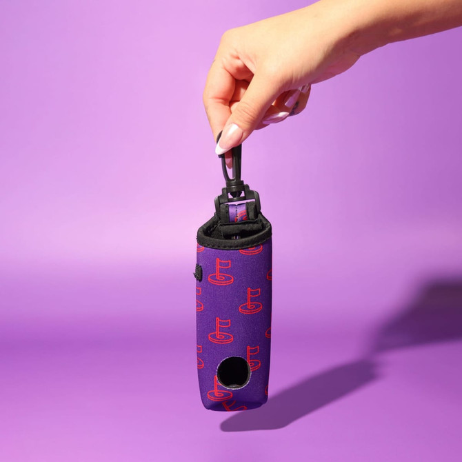 A neoprene golf ball sleeve in purple with a pattern, featuring a strap for easy carrying.