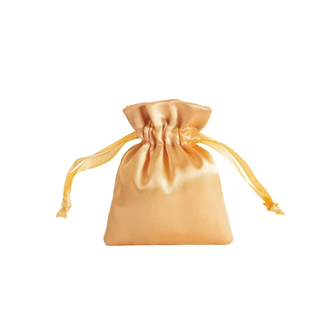 A silk satin drawstring bag in a soft golden hue with matching drawstrings. It features branding.