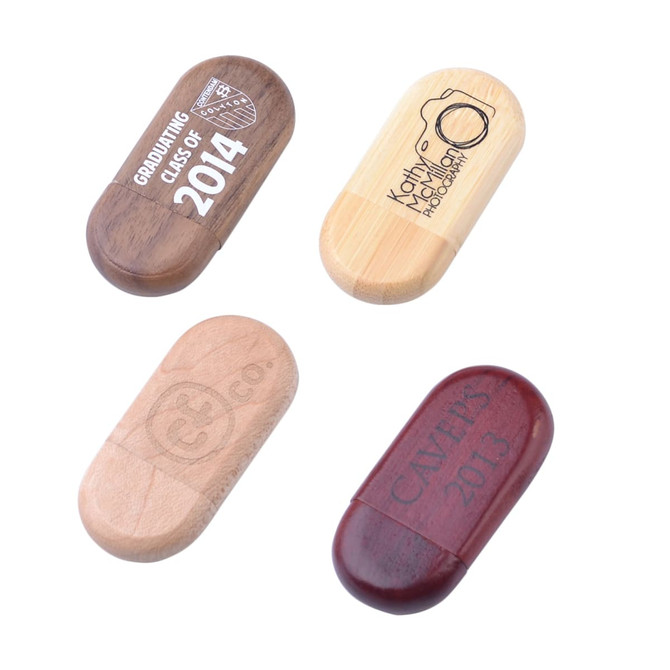 An assortment of oblong wooden flash drives in various finishes, featuring different engravings and a logo.