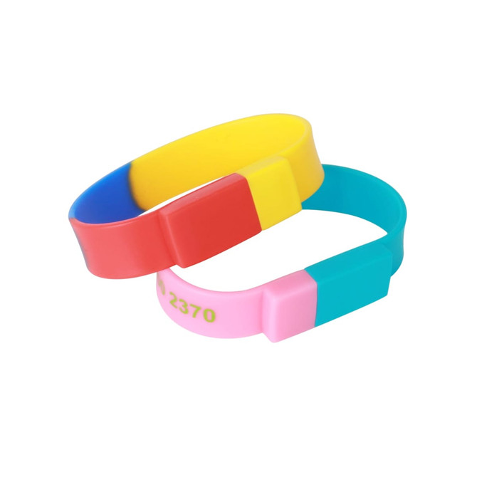 A sectional coloured wristband flash drive featuring blue, yellow, red, pink, and teal sections. It has a logo.