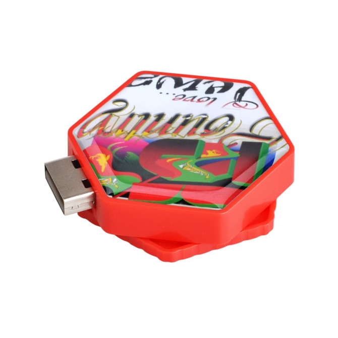 A hexagon-shaped flash drive in red with a colourful design and a metal USB connector on one side.
